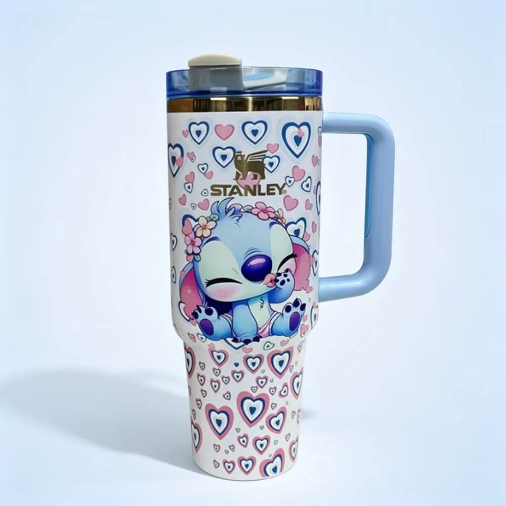 STANLEY tumbler featuring a cute Stitch-inspired character, pastel heart pattern, blue handle, insulated construction, and large-capacity hydration design.