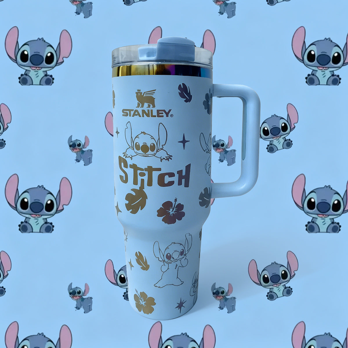 Stanley tumbler with Stitch design on a blue background with cartoon characters.