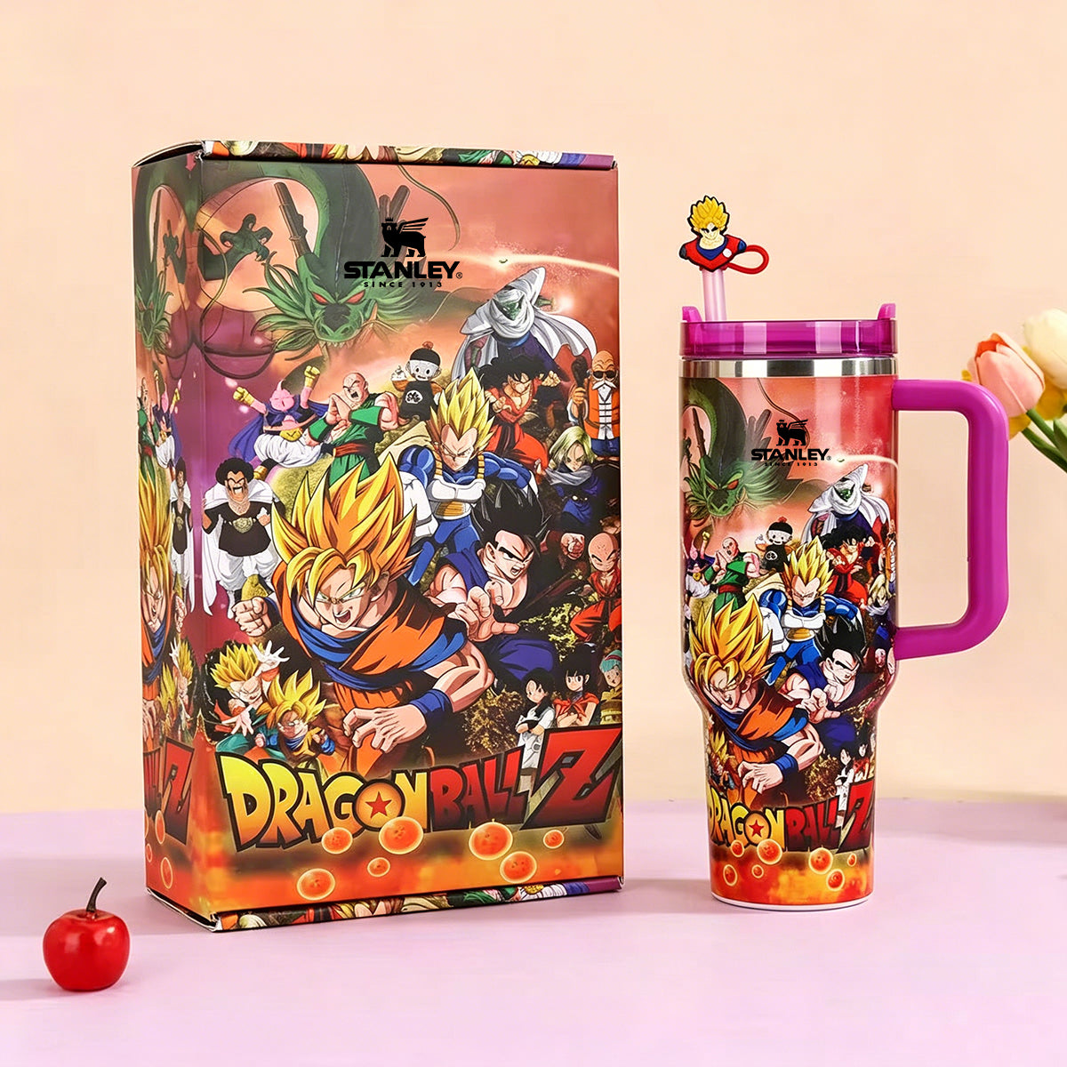 Dragon Ball Z-themed Stanley mug with colorful design on a light pink background