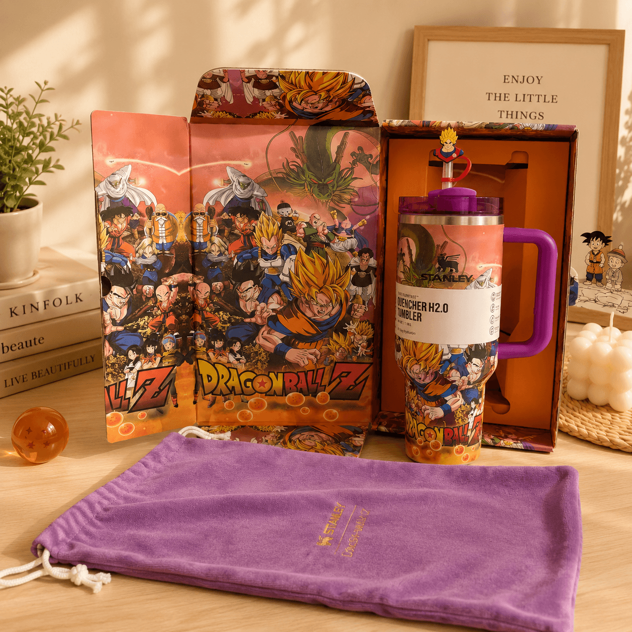 Dragon Ball Z-themed product set including a plush, mug, and pouch on a wooden surface.