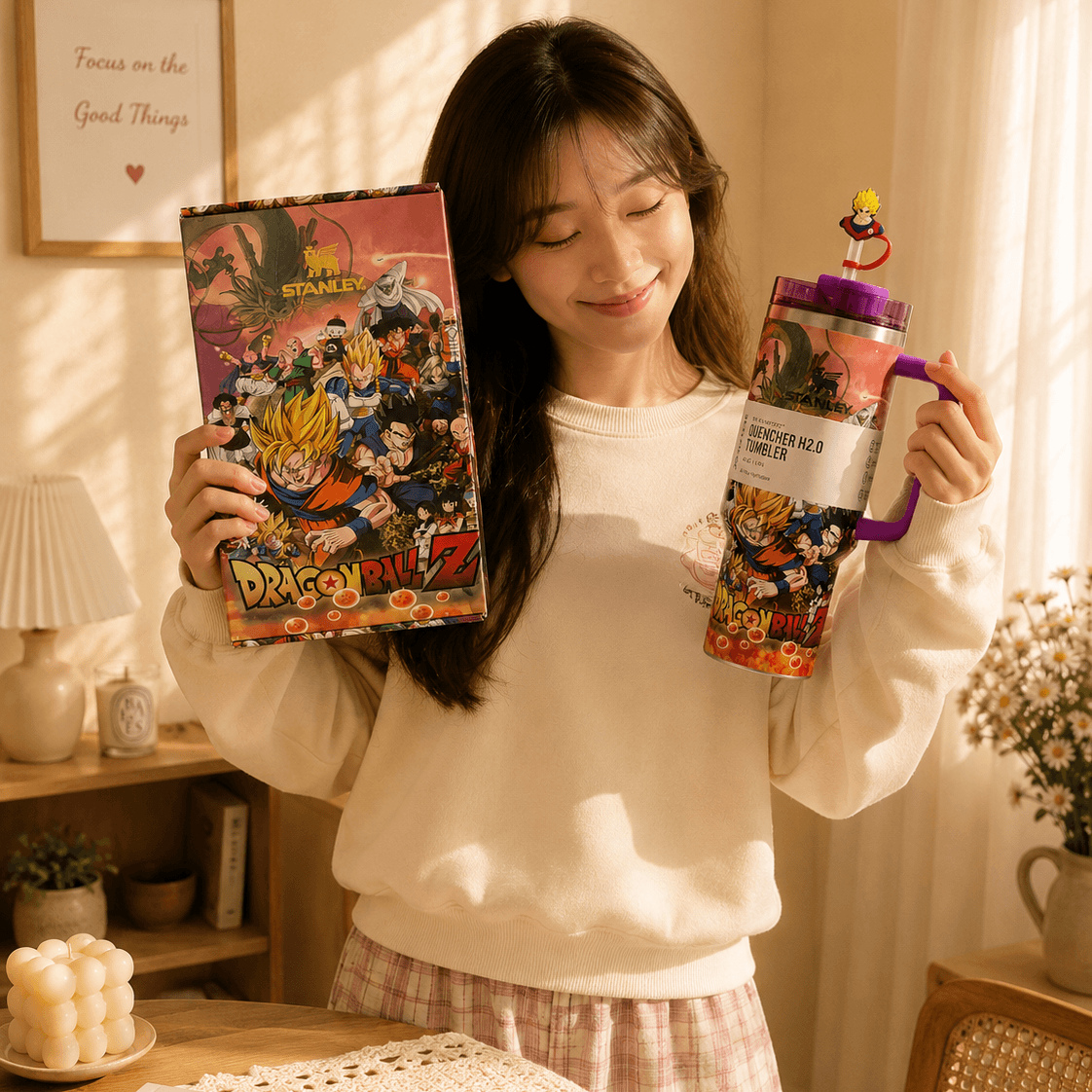 Woman holding a 'Dragon Ball Z' DVD set and a themed water bottle in a cozy room.