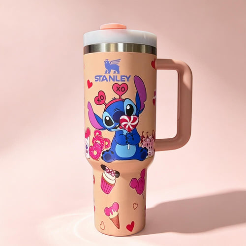 Pink Stanley 40oz insulated tumbler featuring a cute Stitch Valentine's design with hearts, sweets, ergonomic handle, and reusable lid.