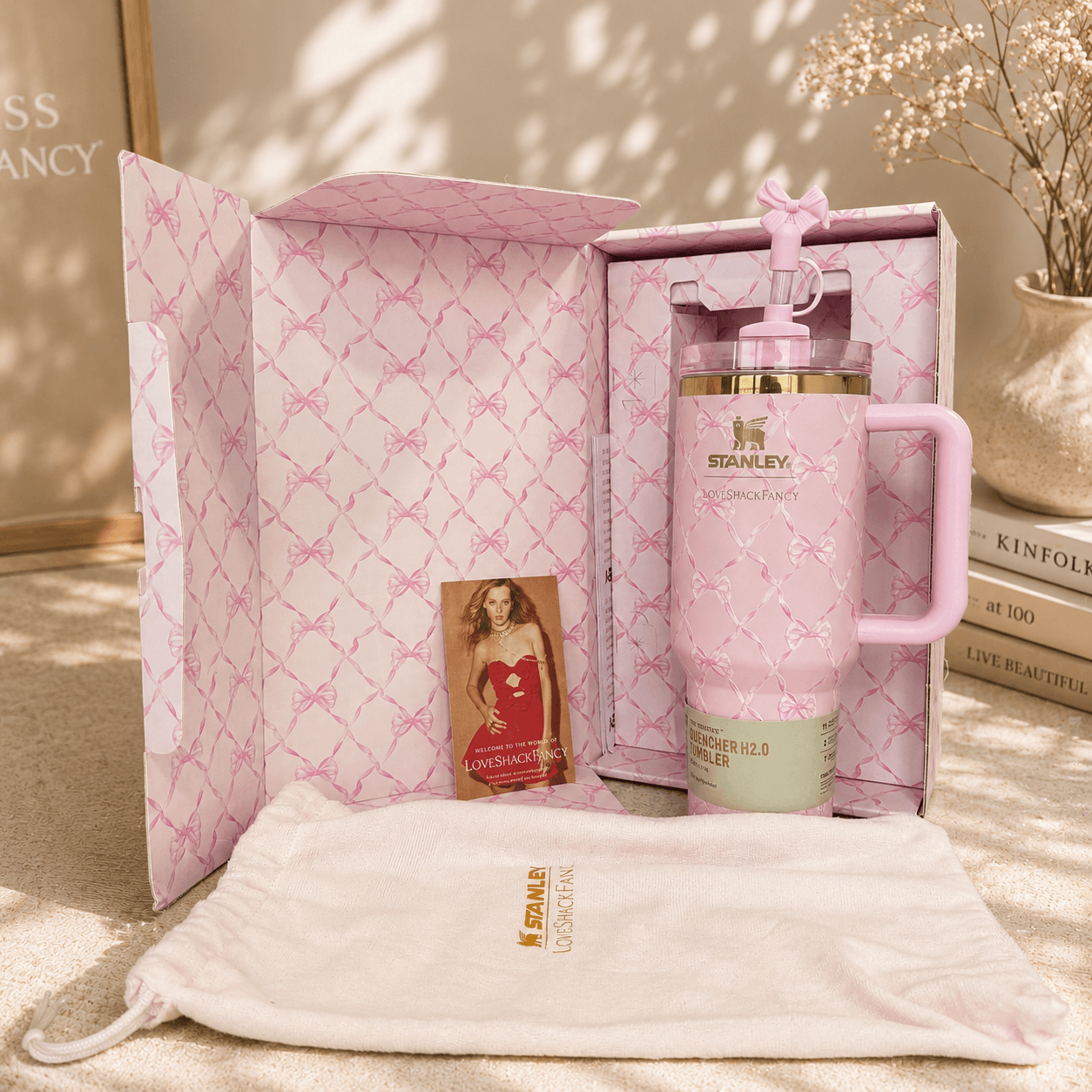 Pink Stanley mug with matching pouch and photo album in a decorative box.