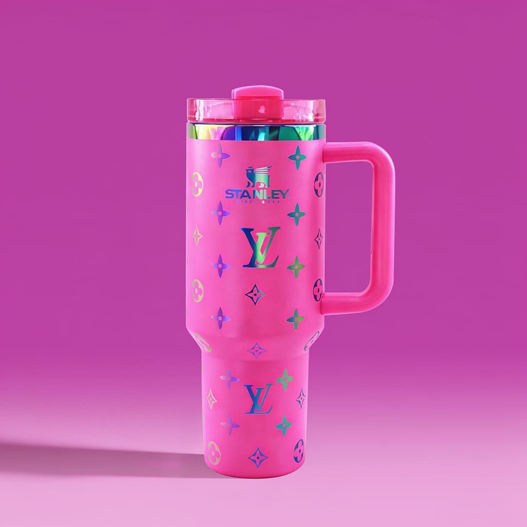 Pink tumbler with colorful patterns on a pink background