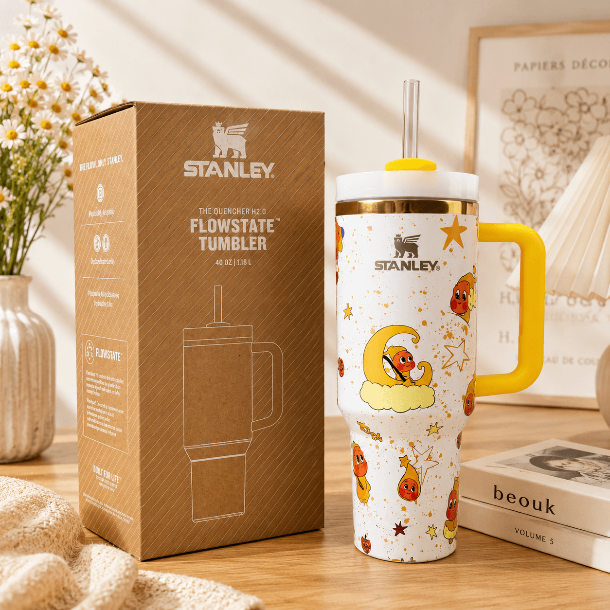 STANLEY Moon Dream tumbler with yellow handle, moon and star illustrations, reusable straw, insulated construction, and matching gift box.