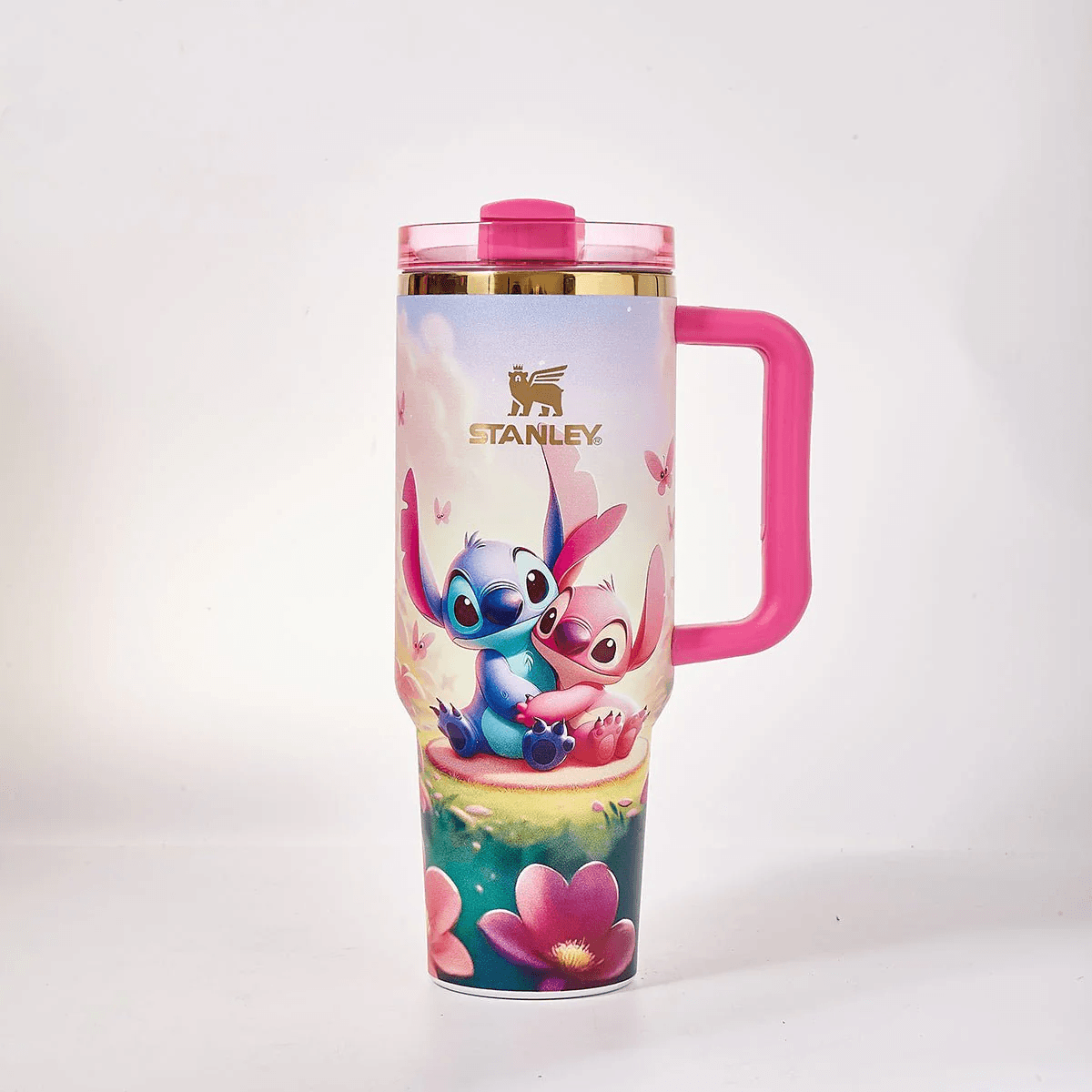 STANLEY Stitch and Angel tumbler gift set featuring pastel floral artwork, pink handle, matching gift box, butterfly accents, and insulated large-capacity design.