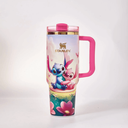 STANLEY Stitch and Angel tumbler gift set featuring pastel floral artwork, pink handle, matching gift box, butterfly accents, and insulated large-capacity design.