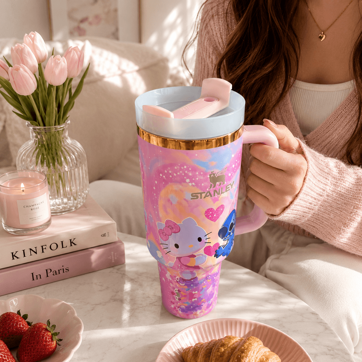STANLEY tumbler featuring Stitch and Kitty-inspired artwork with pink hearts, pastel colors, insulated construction, large handle, and collectible design.