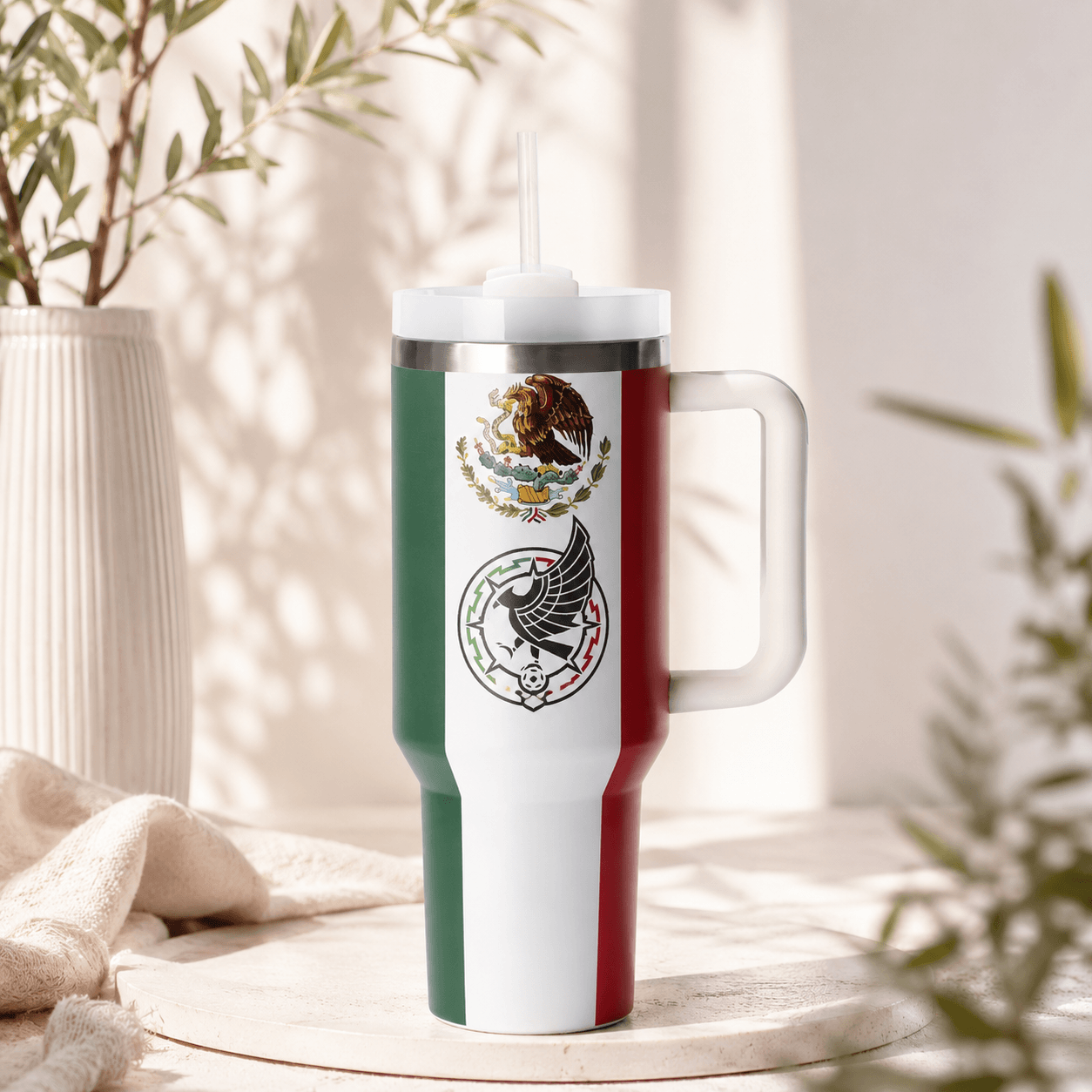 Stanley 40oz insulated tumbler with a Mexico soccer-inspired design featuring the Mexican flag colors, reusable straw, ergonomic handle, stainless steel construction, and double-wall vacuum insulation.