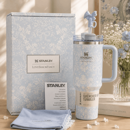 Stanley LoveShackFancy 40oz insulated tumbler gift set with a light blue vintage floral pattern, matching gift box, bow straw topper, reusable straw, ergonomic handle, and double-wall vacuum insulation.