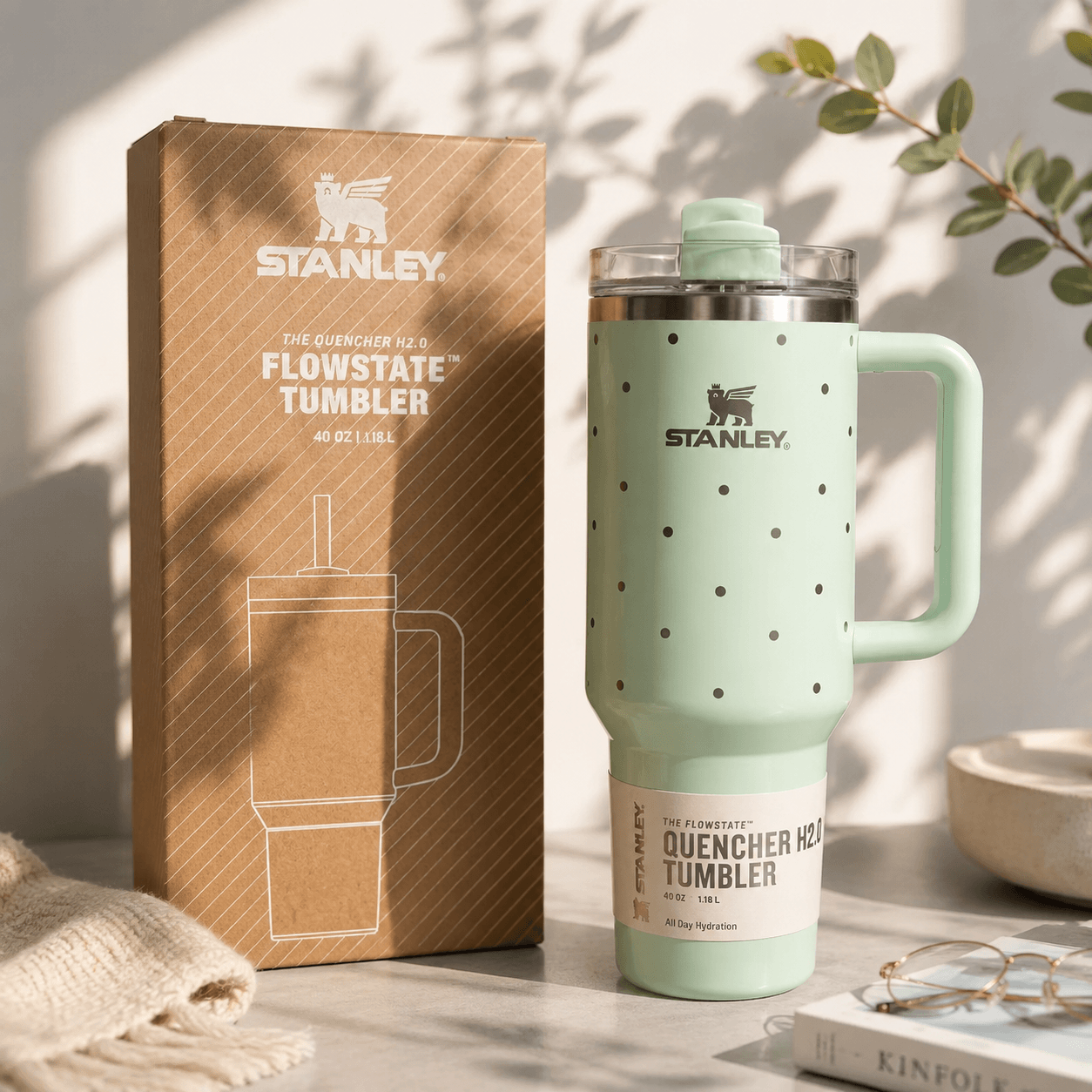 Stanley Mint Green Polka Dot 40oz insulated tumbler with reusable straw, ergonomic handle, stainless steel construction, and Stanley gift box.