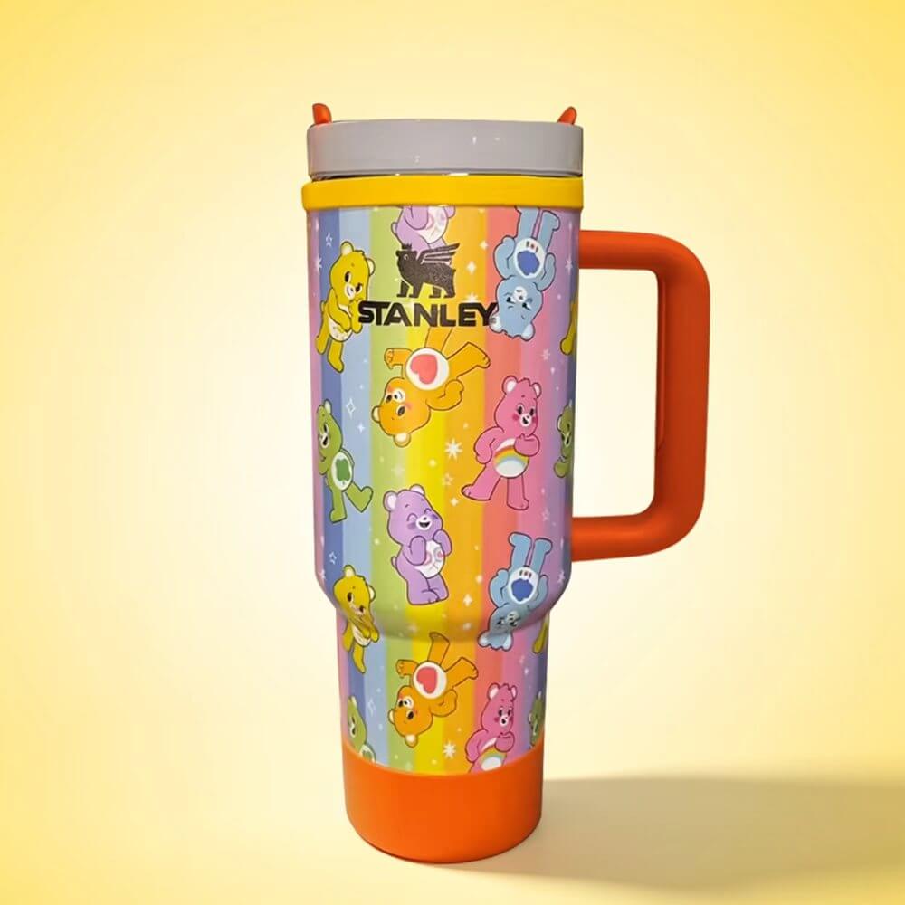 Stanley mug with cartoon bear design on a yellow background