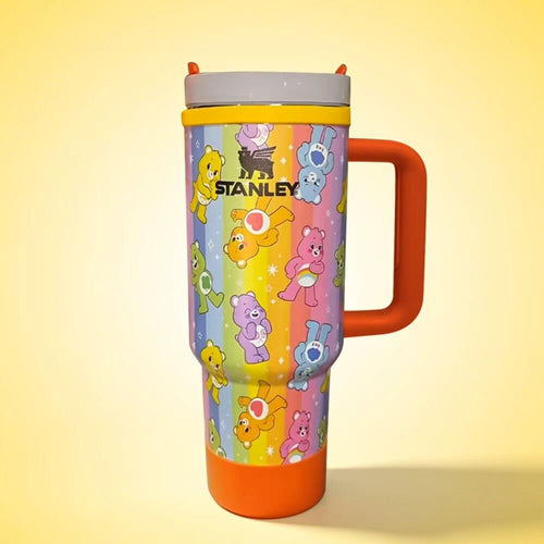 Stanley mug with cartoon bear design on a yellow background