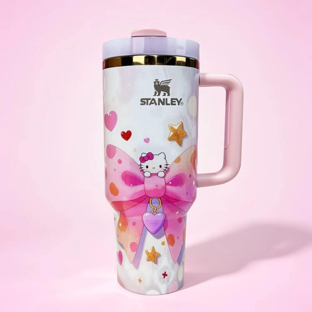 Stanley tumbler with Hello Kitty design on a pink background