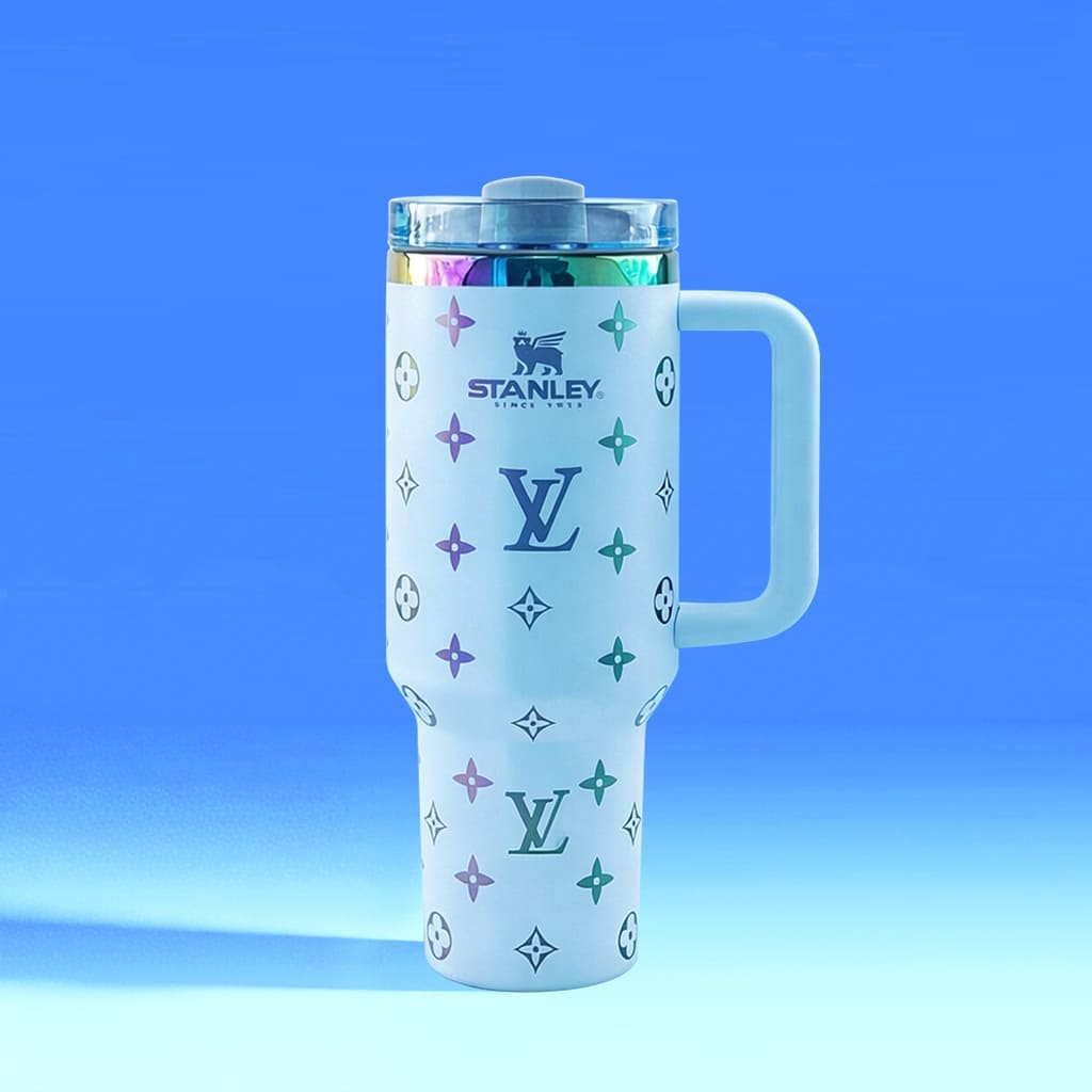 Stanley tumbler with Louis Vuitton monogram design on a blue gradient background