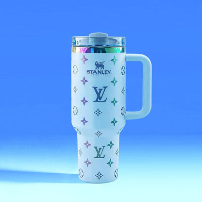 Stanley tumbler with Louis Vuitton monogram design on a blue gradient background
