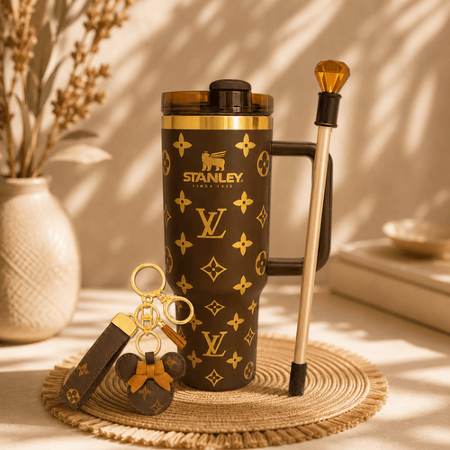 Stanley tumbler with Louis Vuitton pattern on a textured surface