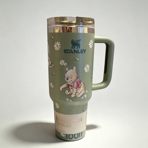 Stanley tumbler with Winnie the Pooh design on a white background
