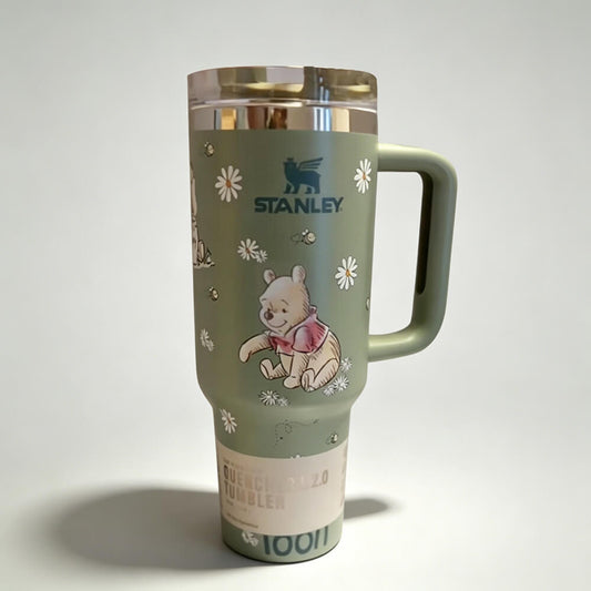 Stanley tumbler with Winnie the Pooh design on a white background