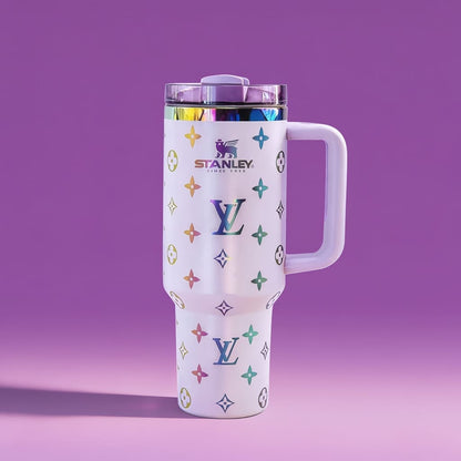 Stanley tumbler with colorful logo pattern on a purple background