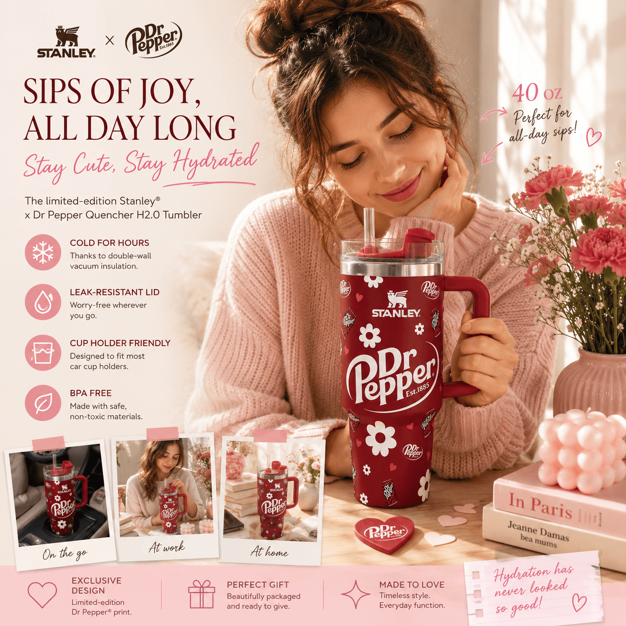 A woman in a pink sweater holds a red Stanley x Dr Pepper Quencher H2.0 tumbler with white floral graphics and a straw.