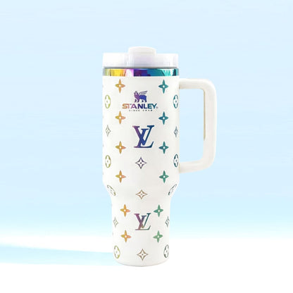 White tumbler with colorful logos on a light blue background