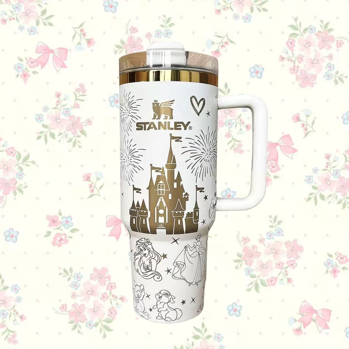 Stanley travel mug with Disney castle design on a floral background