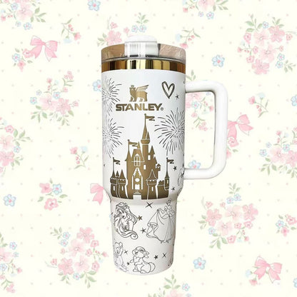 Stanley travel mug with Disney castle design on a floral background